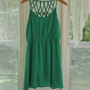 Green spaghetti strap dress with details on back